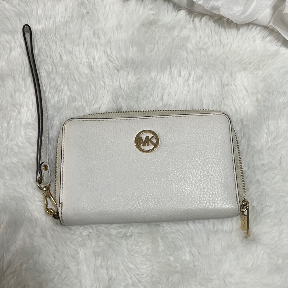White Michael Kors wrist wallet , used.